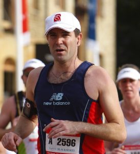 John Kerrison taking part in a race wearing running gear